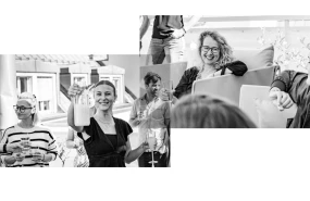 Glueckliches Team beim gemeinsamen Anstoßen mit Getraenken