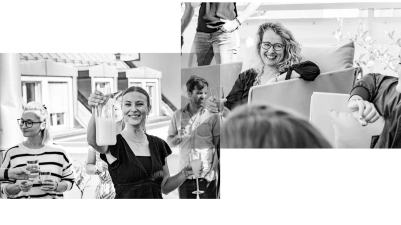 Glueckliches Team beim gemeinsamen Anstoßen mit Getraenken
